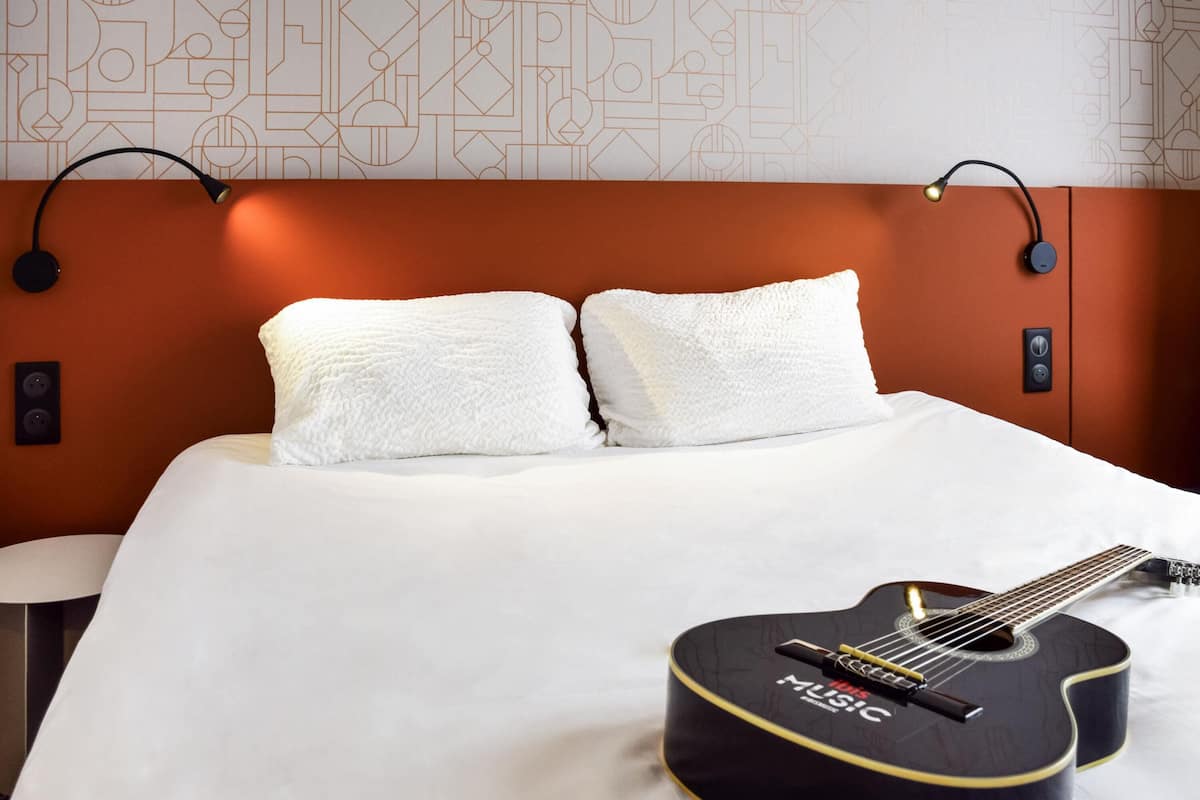 Premium bedding, desk, laptop workspace, blackout curtains