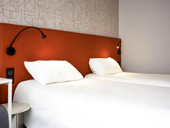 Premium bedding, desk, laptop workspace, blackout curtains