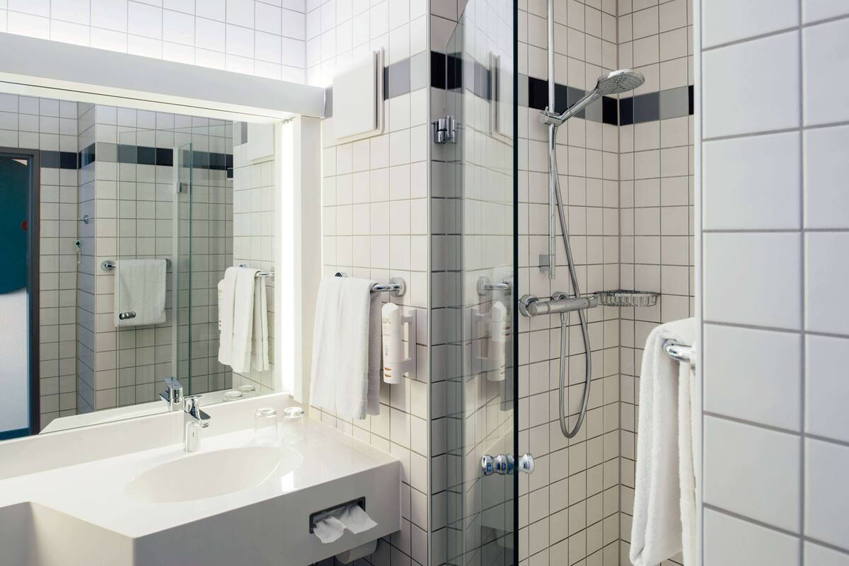 hair dryer, bathrobes, slippers, towels