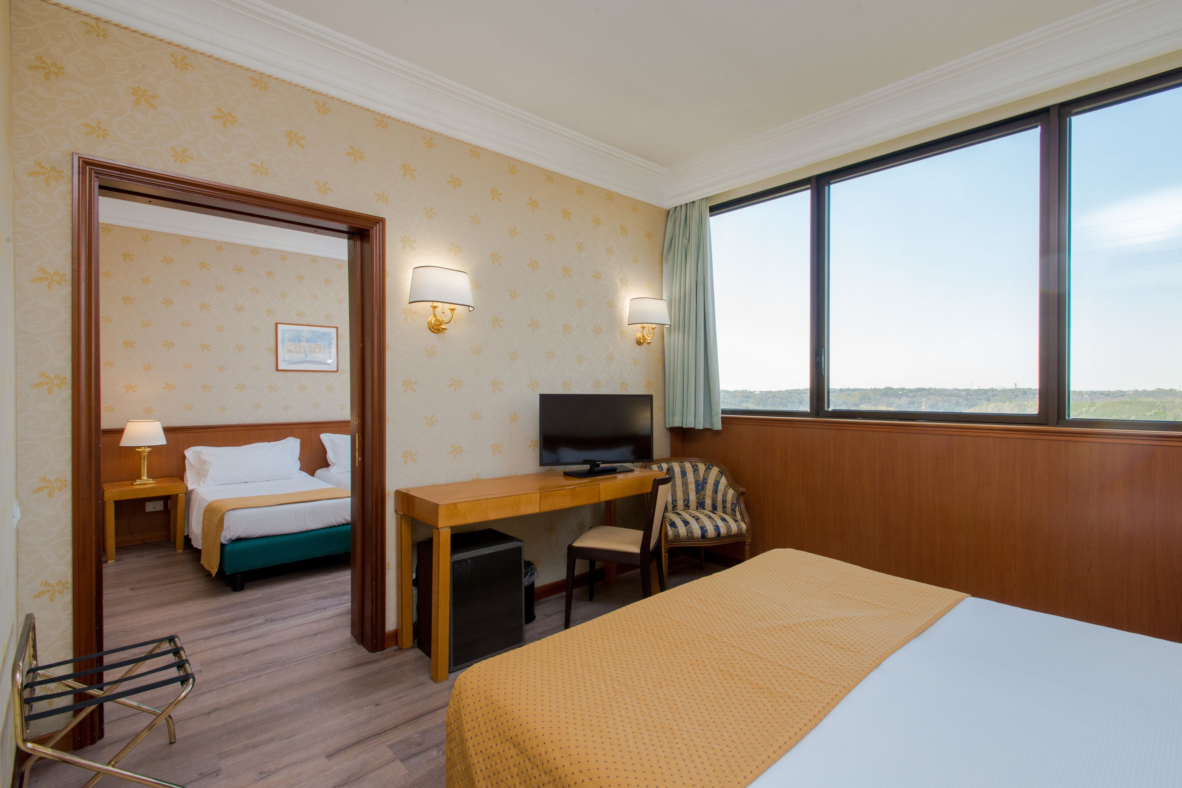 family room | premium bedding, in-room safe, desk, iron/ironing board