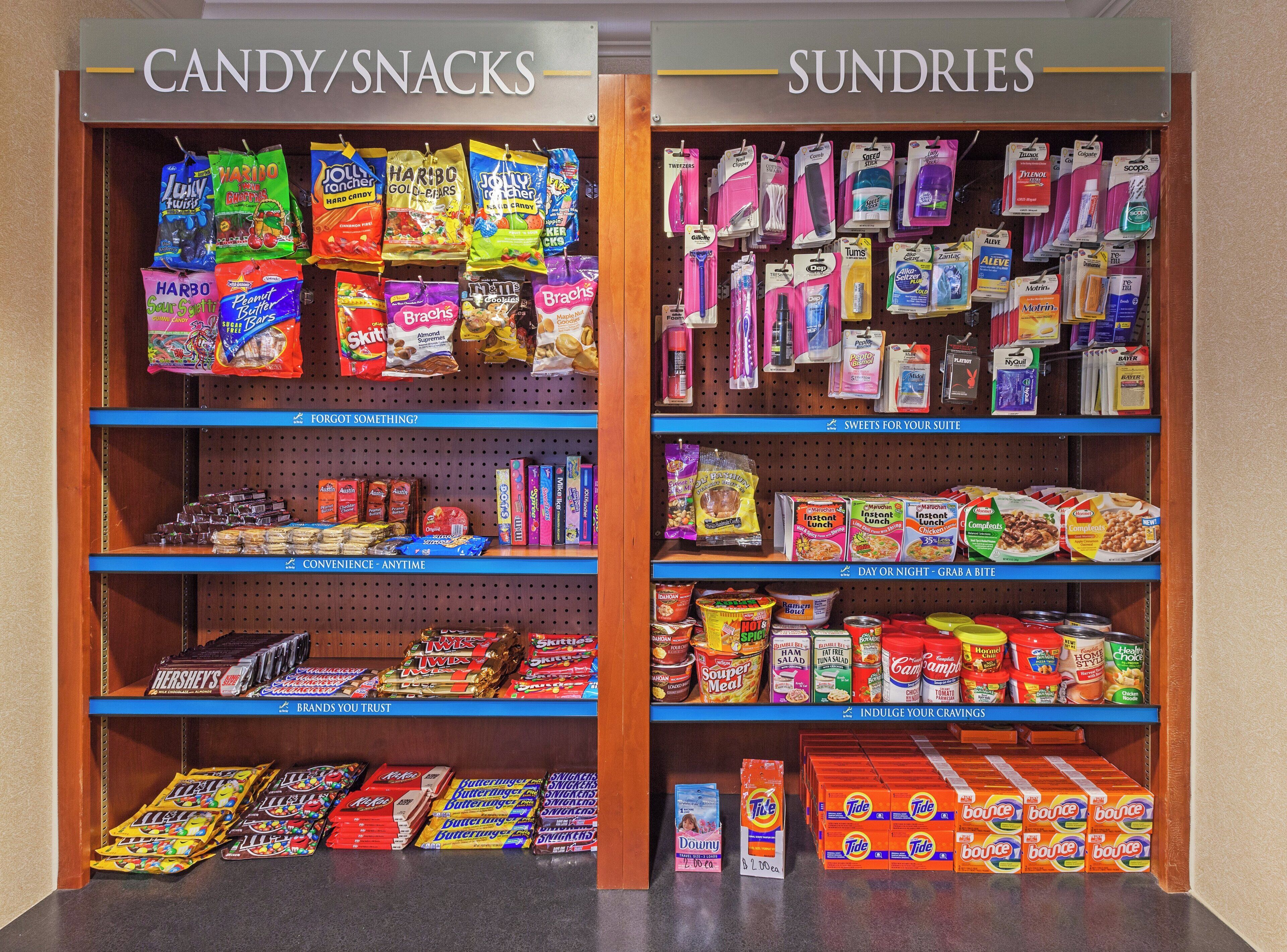 A candy/snacks section with various brands and types of snacks.
