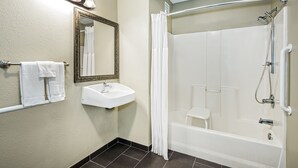 A bathroom with a sink, mirror, and shower. - Staybridge Suites Round Rock by IHG (Round Rock)