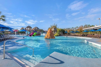 2 outdoor pools, pool umbrellas, sun loungers at Hilton Vacation Club Aqua Sol Orlando West