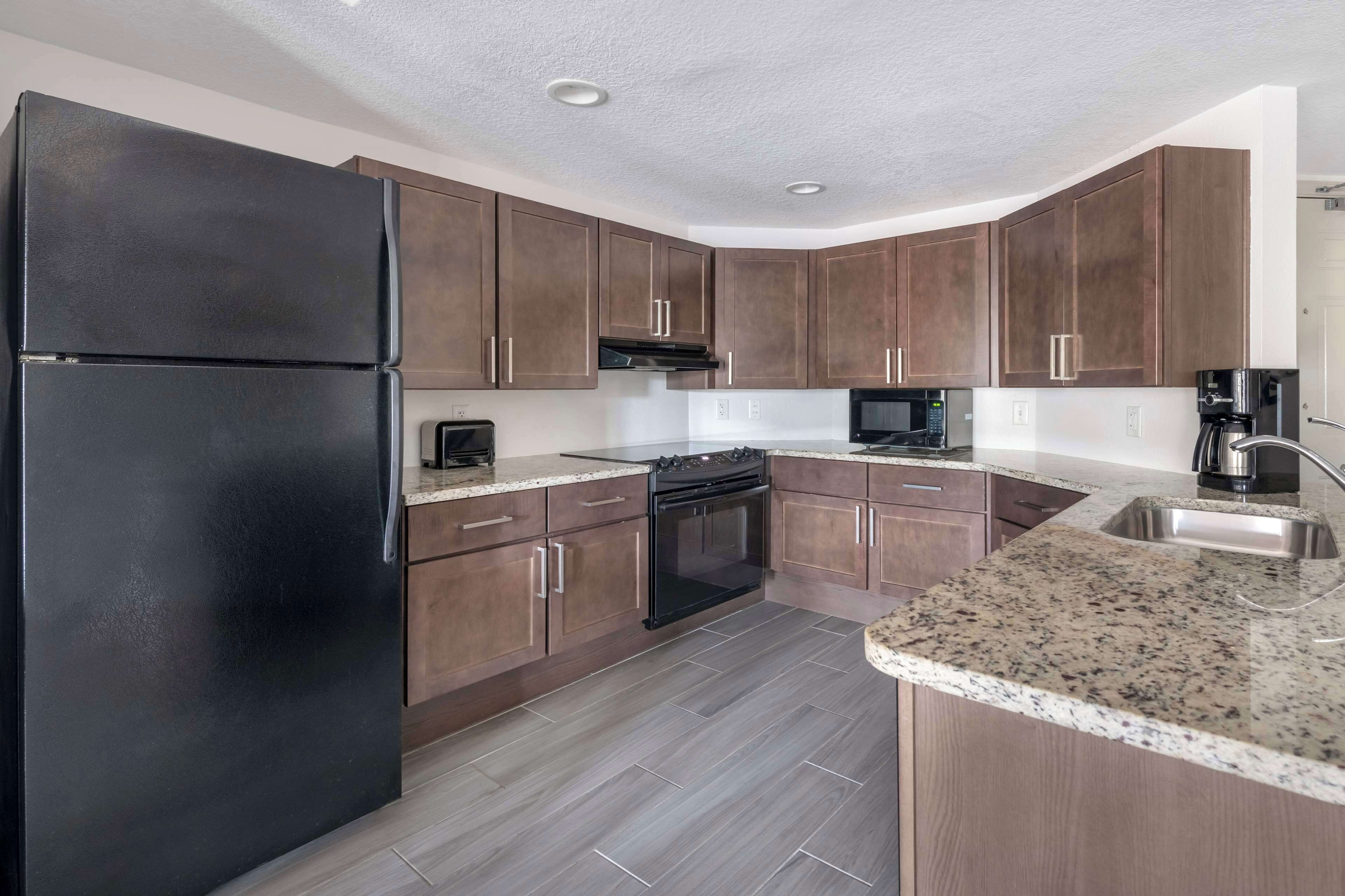 1 bedroom queen suite hearing access roll-in shower | private kitchen | coffee/tea maker, dining tables