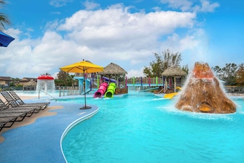 2 outdoor pools, pool umbrellas, sun loungers at Hilton Vacation Club Aqua Sol Orlando West