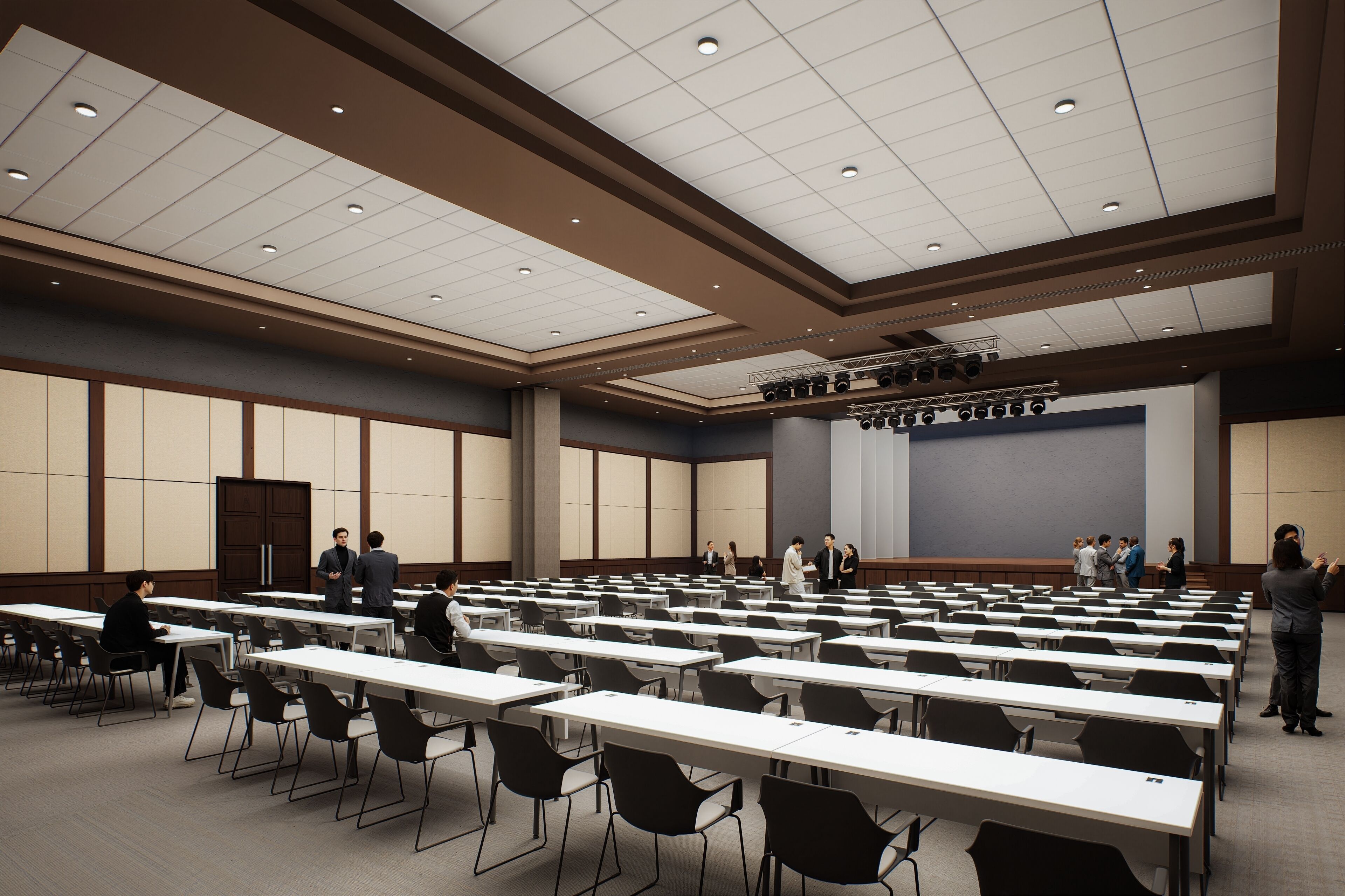 A conference room with tables and chairs, a stage with lighting, and a large screen.