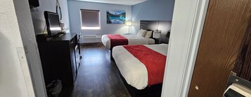 Family Room, 2 Double Beds | Down comforters, desk, laptop workspace, blackout drapes