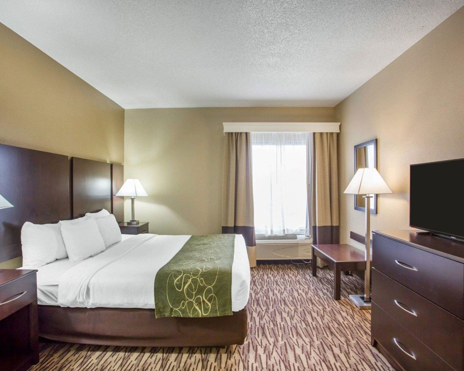 Premium bedding, desk, laptop workspace, iron/ironing board