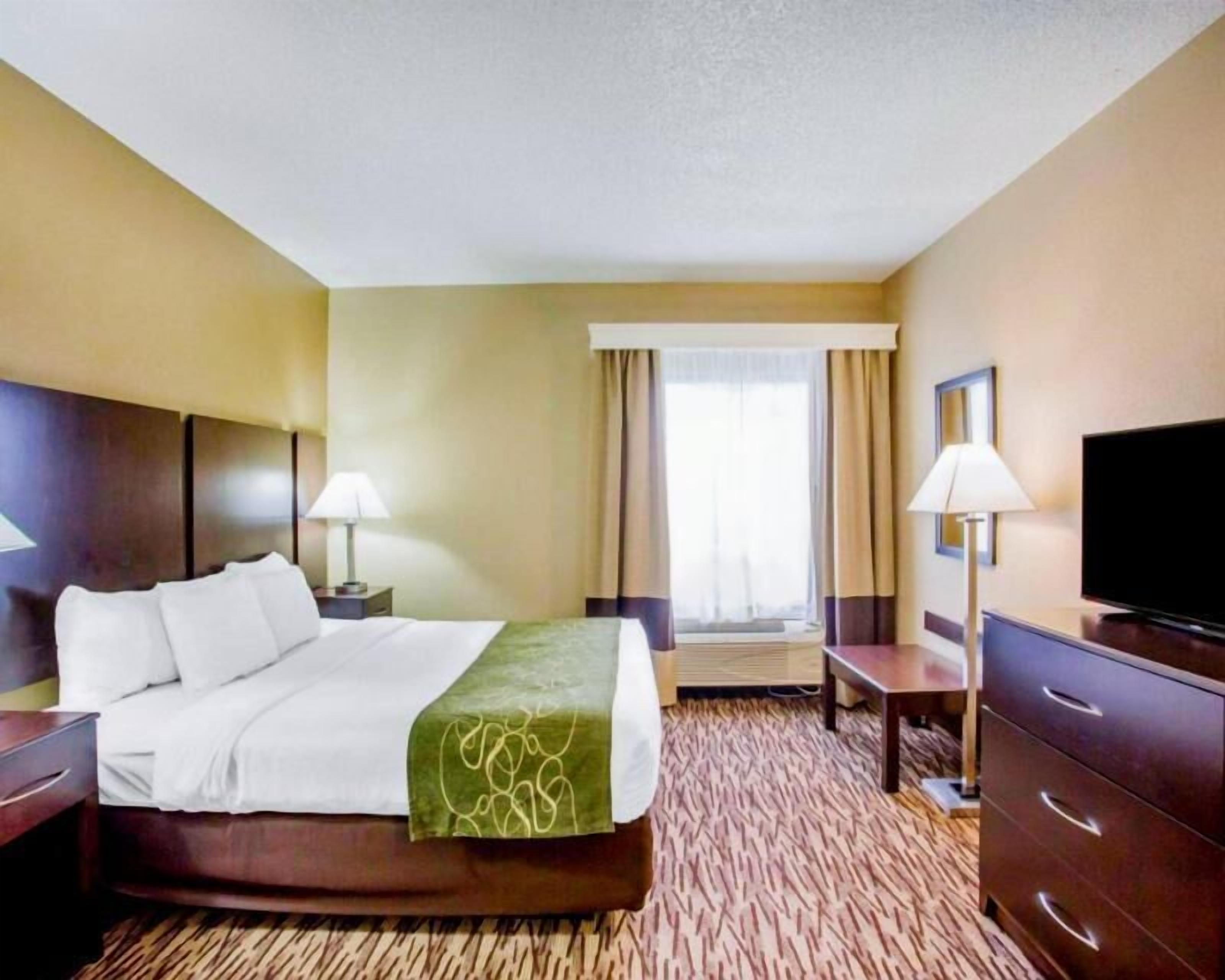Premium bedding, desk, laptop workspace, iron/ironing board