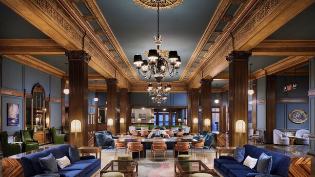 A spacious lobby with a grand chandelier, multiple seating areas, and a reception desk. - The Marcus Whitman Hotel (Walla Walla)