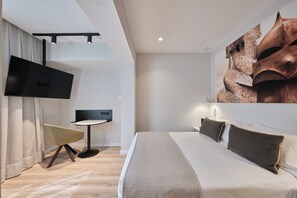Ropa de cama de alta calidad, minibar, caja fuerte y escritorio