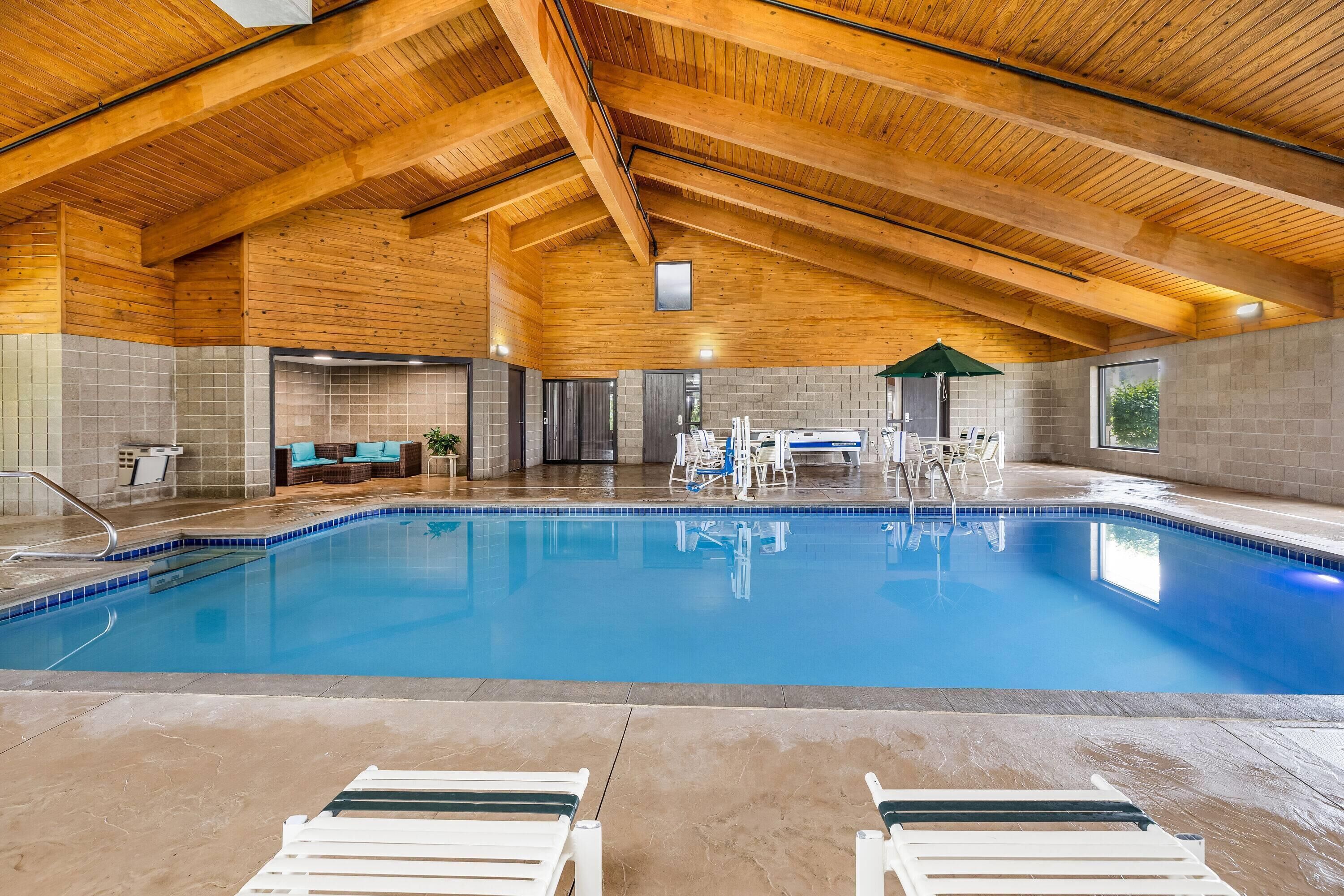 Indoor pool, open 8:00 AM to 10:00 PM, pool loungers