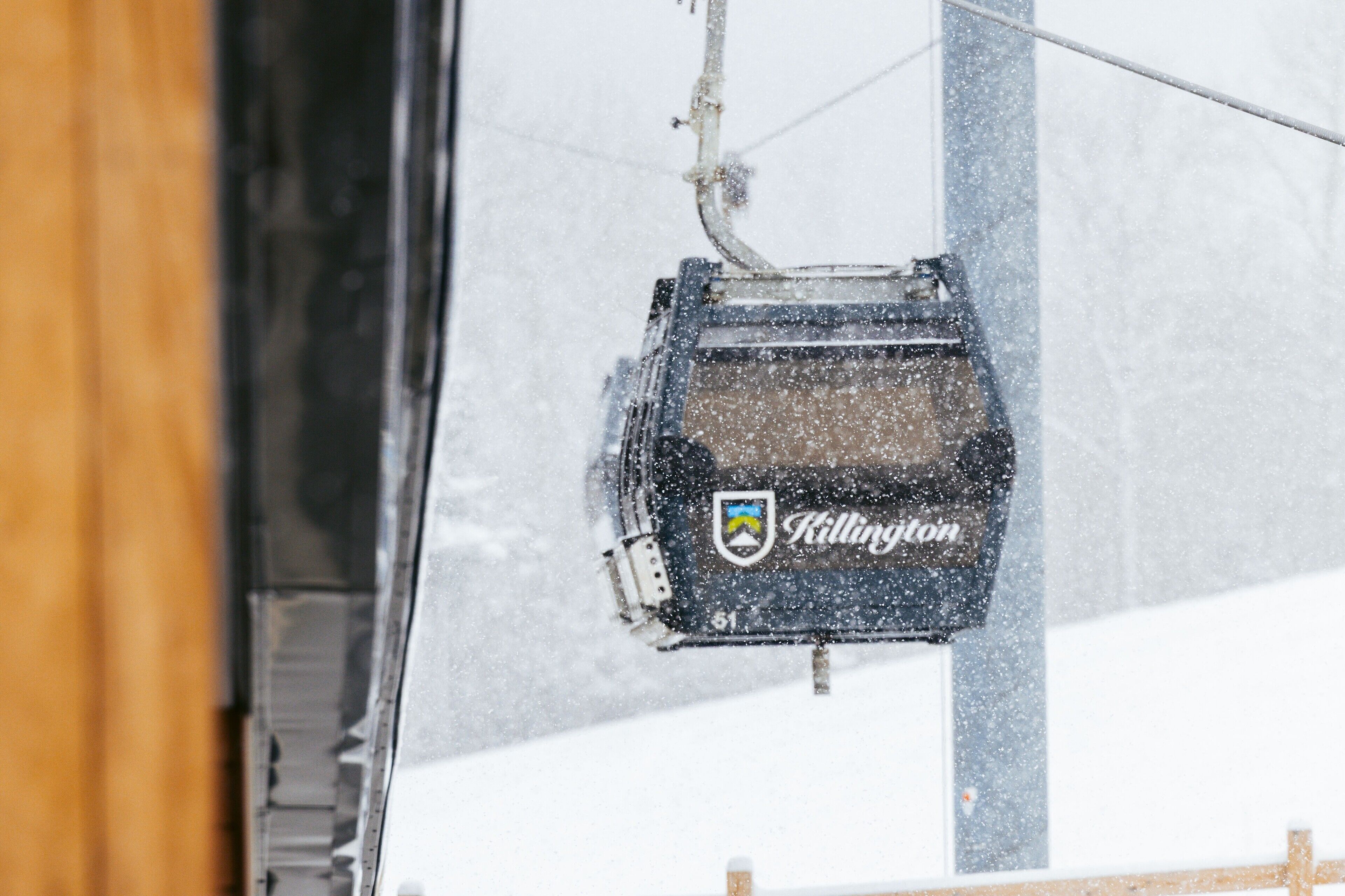 A snow-covered chairlift with the name "Killington" visible.
