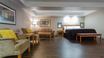 Studio, 1 King Bed | Living area | 32-inch TV with cable channels