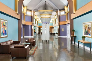 Relax in the hotel lobby, surrounded by comfortable seating and beautiful artwork.