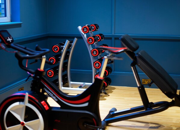 A stationary bike with a digital display and multiple resistance settings.