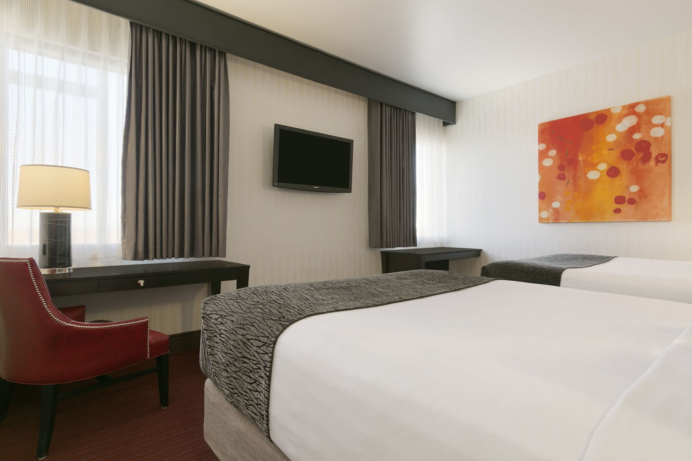 classic room, 2 queen beds (cactus tower) | in-room safe, iron/ironing board, rollaway beds, bed sheets