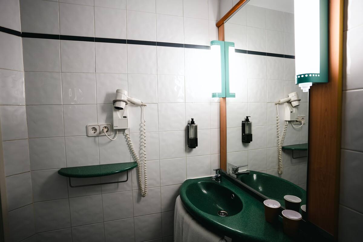 shower, eco-friendly toiletries, hair dryer, towels