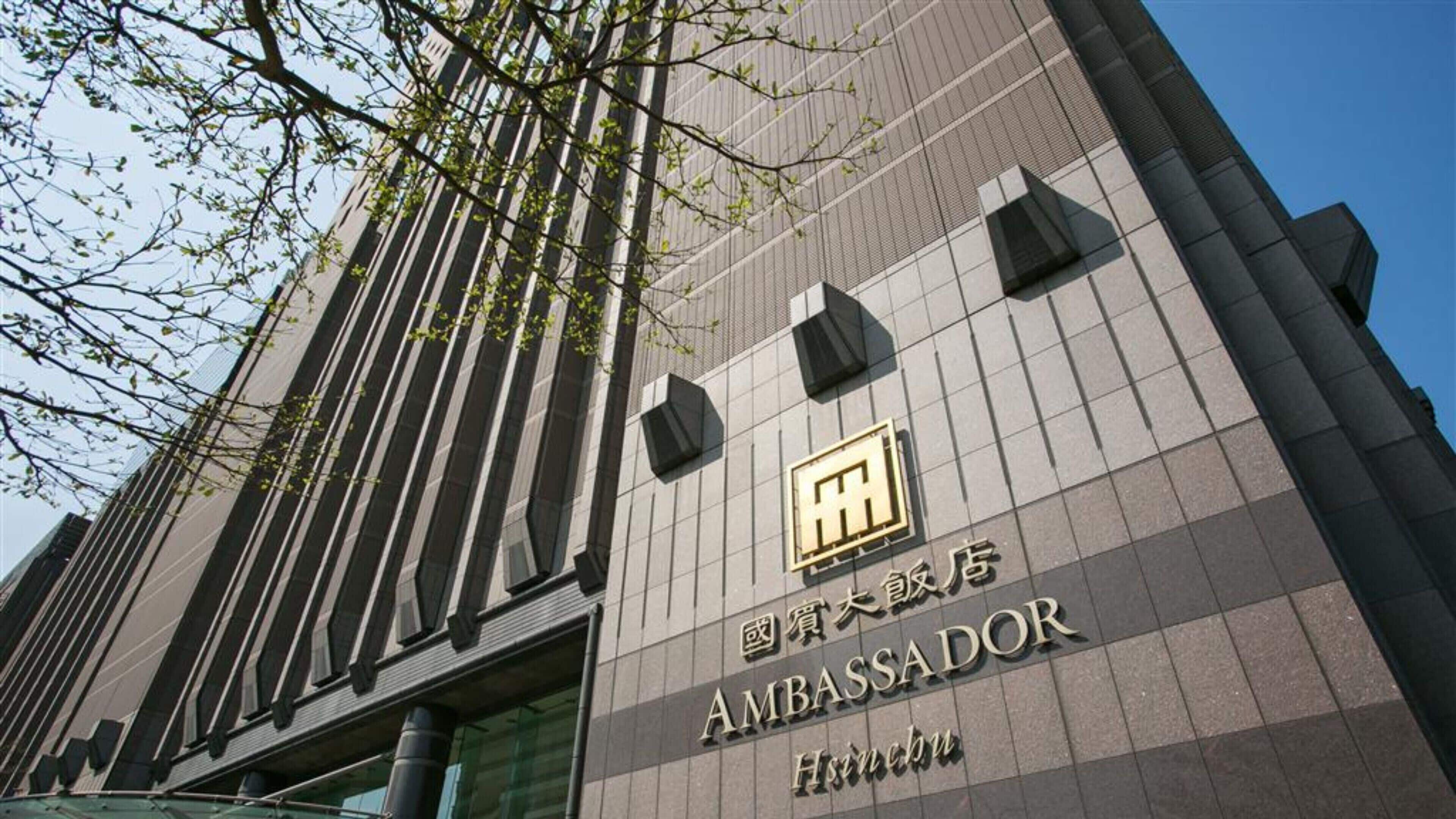 A modern building with a sign that reads "AMBASSADOR".
