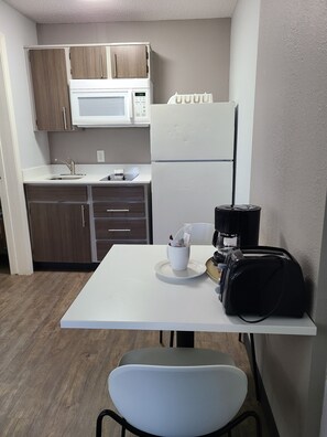 Fridge, microwave, stovetop, coffee/tea maker