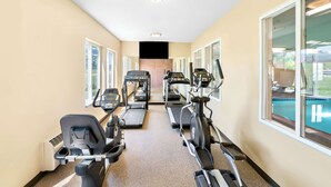 A fitness center with treadmills, elliptical machines, and a stair climber. - Best Western Nebraska City Inn (Nebraska City)