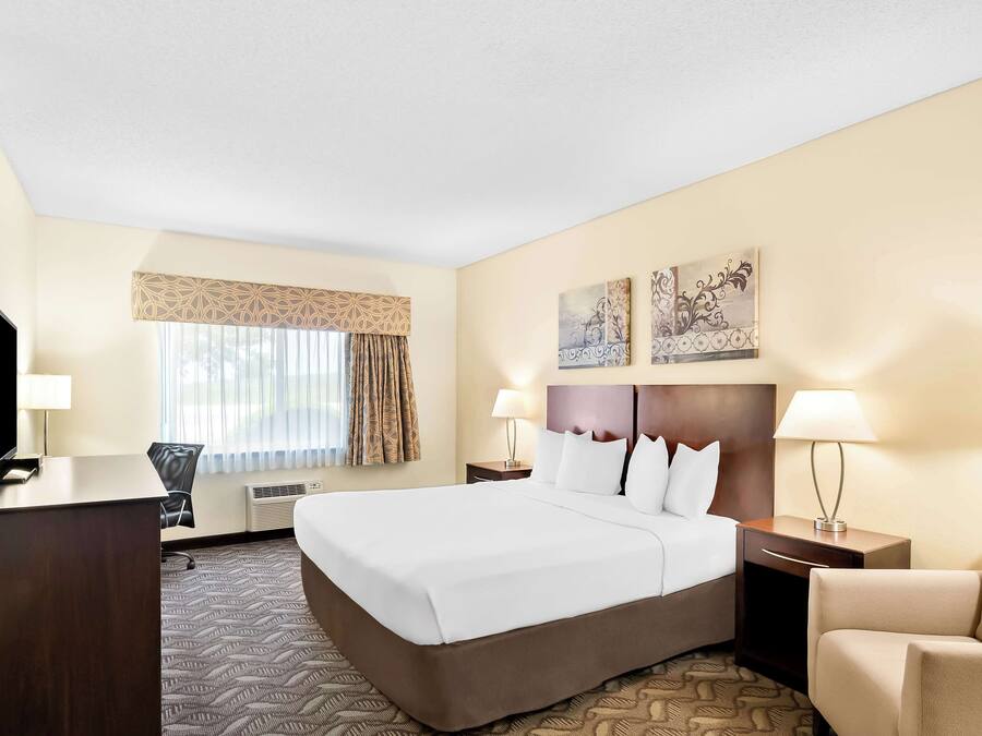 Hypo-allergenic bedding, desk, laptop workspace, blackout curtains