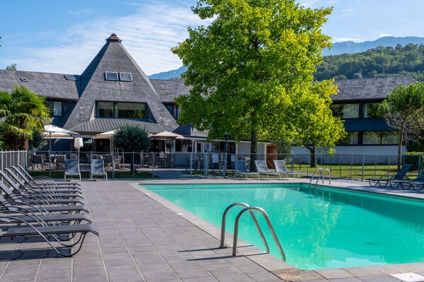 Seasonal outdoor pool, open 9:30 AM to 7:00 PM, pool loungers