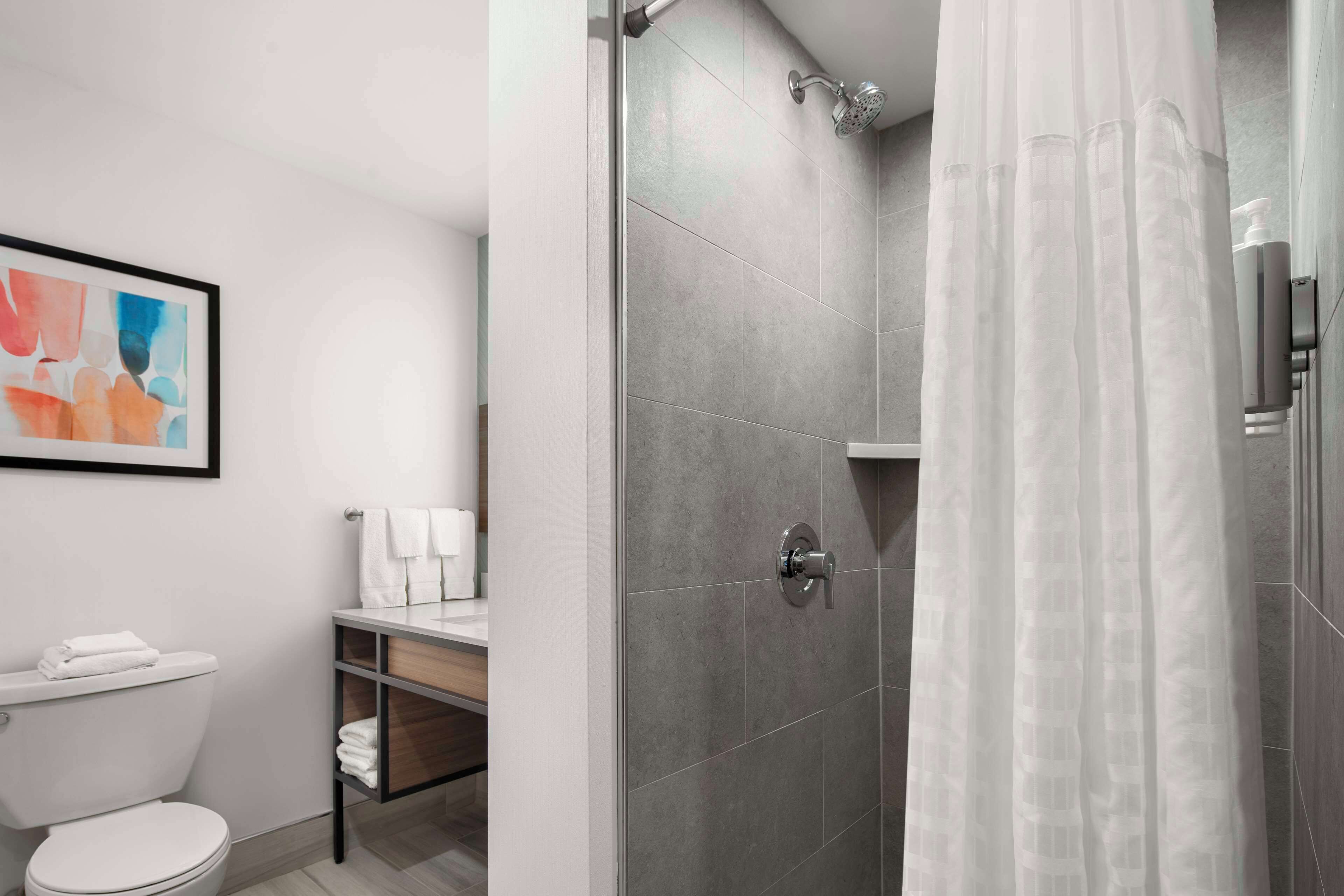 designer toiletries, hair dryer, towels