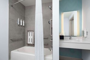 Designer toiletries, hair dryer, towels