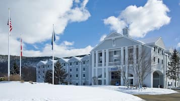 A large, multi-story hotel with a prominent entrance and a sign reading "North Conway Grand Hotel".