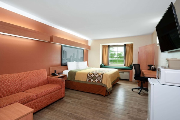 Suite, 1 King Bed, Accessible, Non Smoking (Mobility/Roll-in Shower) | Desk, laptop workspace, blackout drapes, iron/ironing board