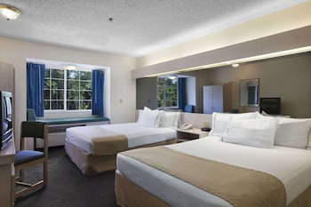 In-room safe, desk, iron/ironing board, cribs/infant beds at Microtel Inn & Suites by Wyndham Palm Coast I-95