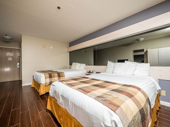 In-room safe, desk, iron/ironing board, cribs/infant beds at Microtel Inn & Suites by Wyndham Palm Coast I-95