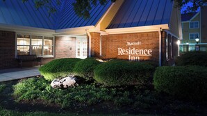 A Marriott Residence Inn with a brick facade, large windows, and a well-maintained garden area. - Residence Inn by Marriott Monroe (Monroe)