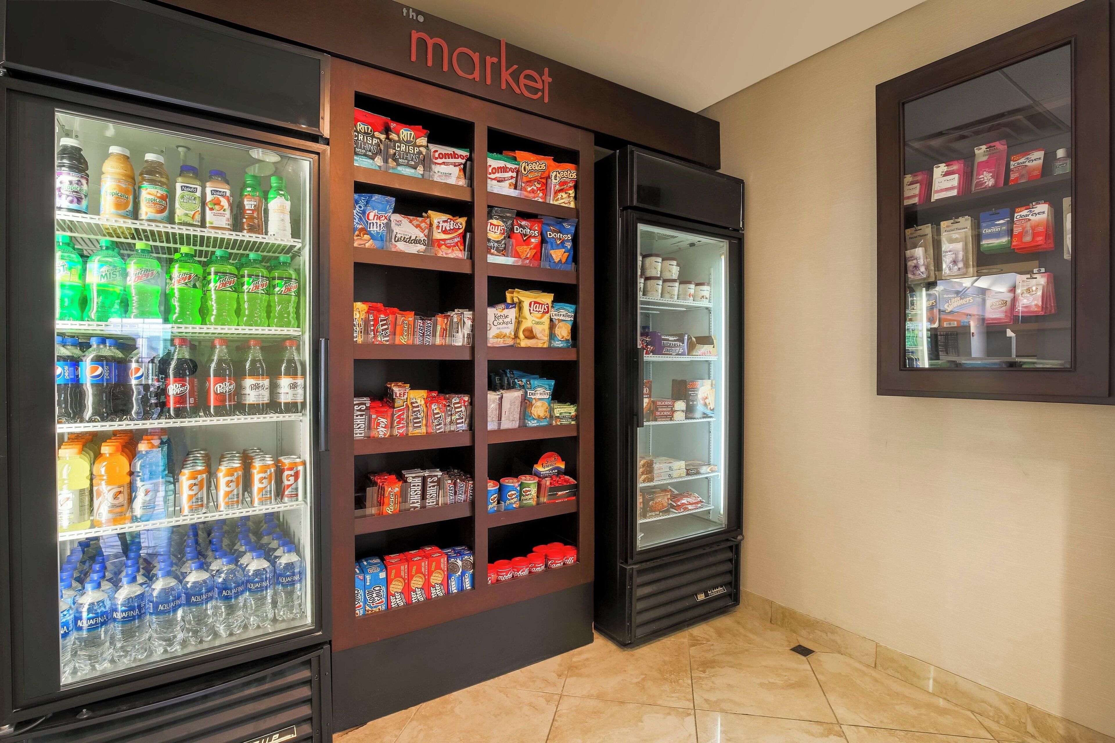 A vending machine area with various snacks and drinks.