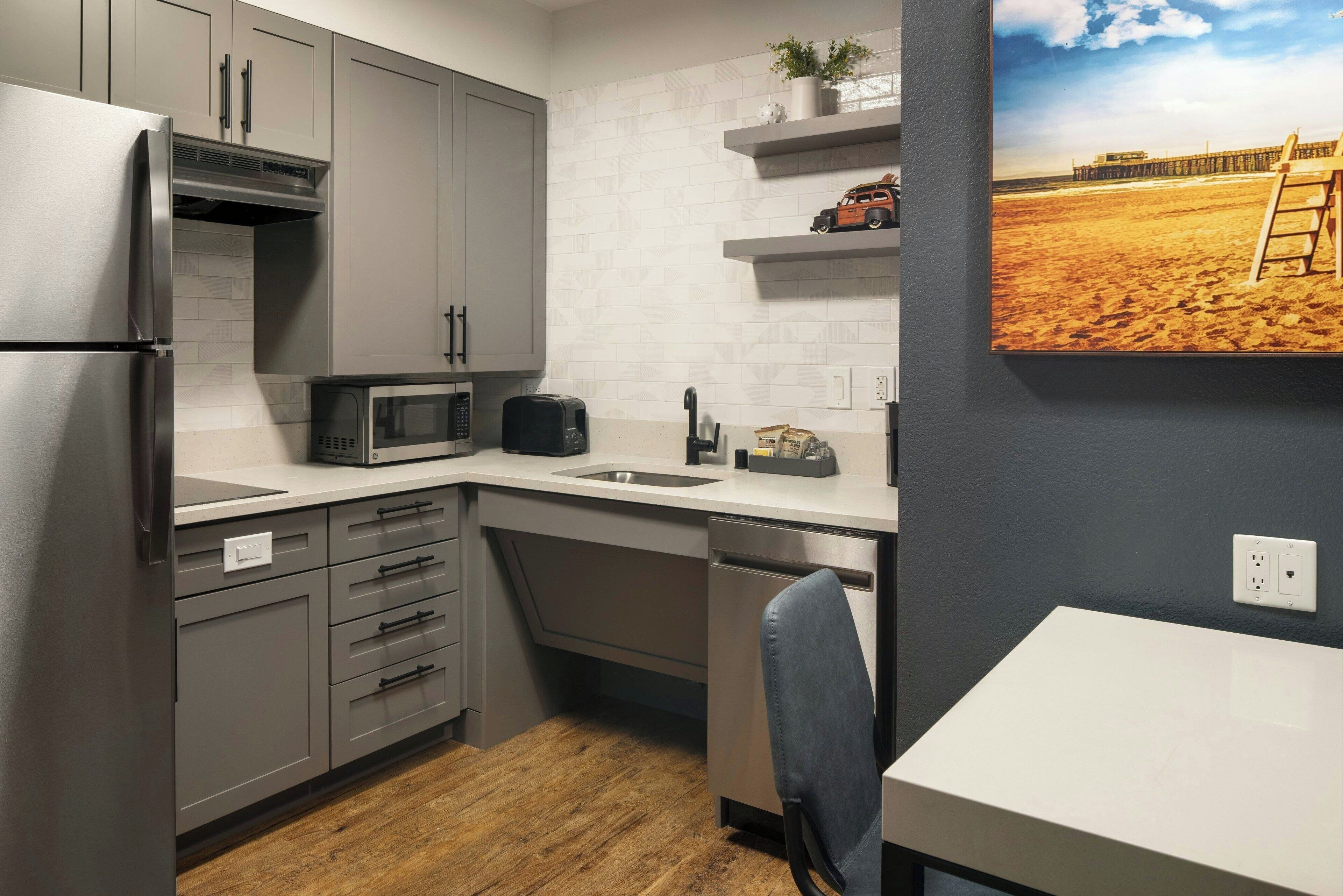 full-sized fridge, microwave, stovetop, dishwasher