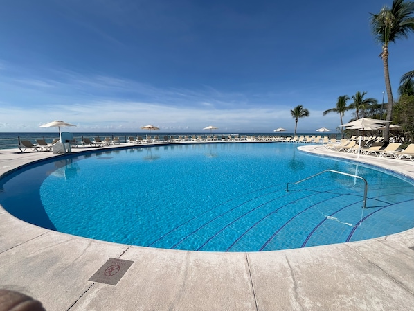 3 outdoor pools, open 8:00 AM to 8:00 PM, pool umbrellas, pool loungers