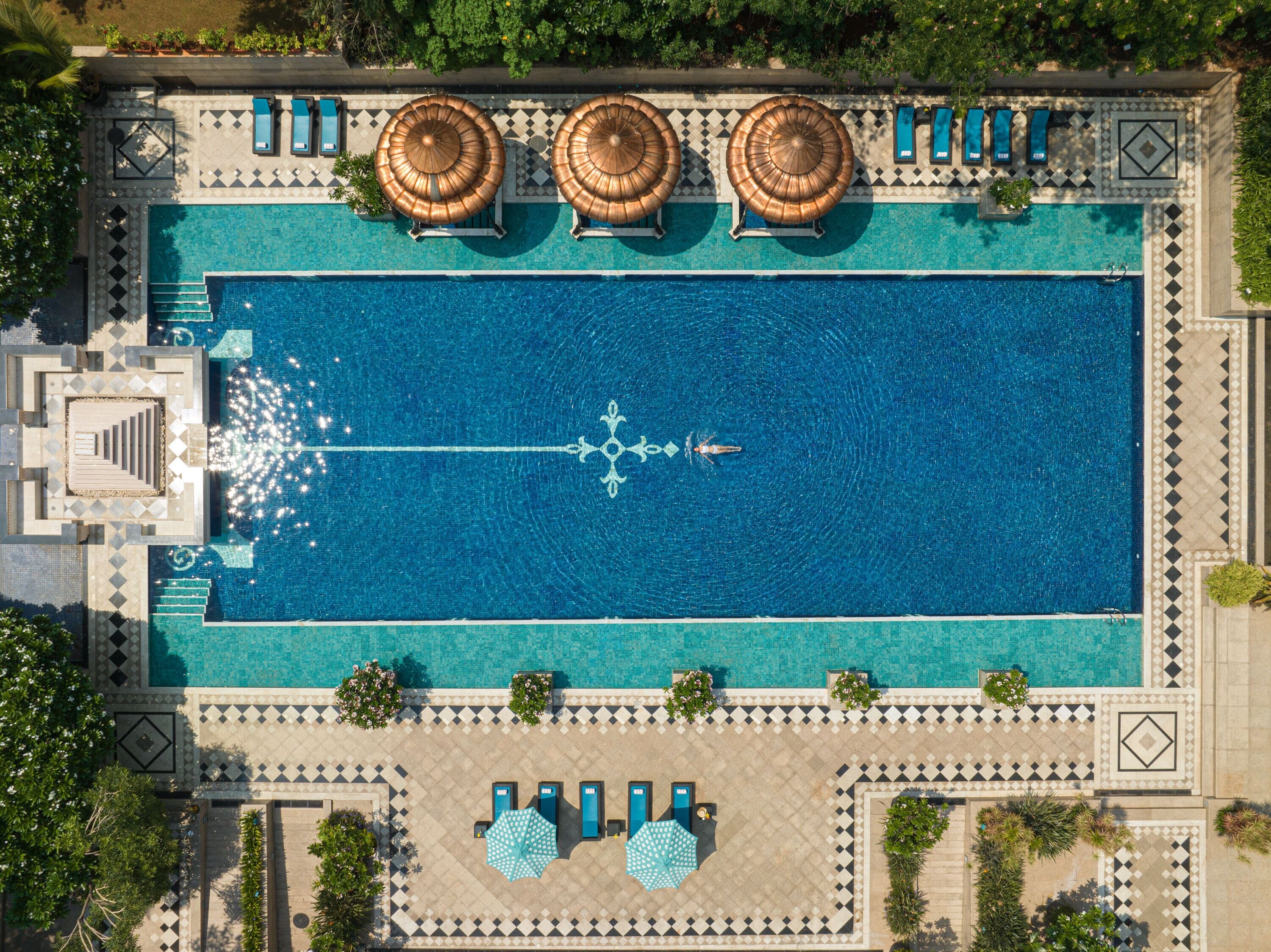 outdoor pool, open 8:00 am to 8:00 pm, pool umbrellas, pool loungers