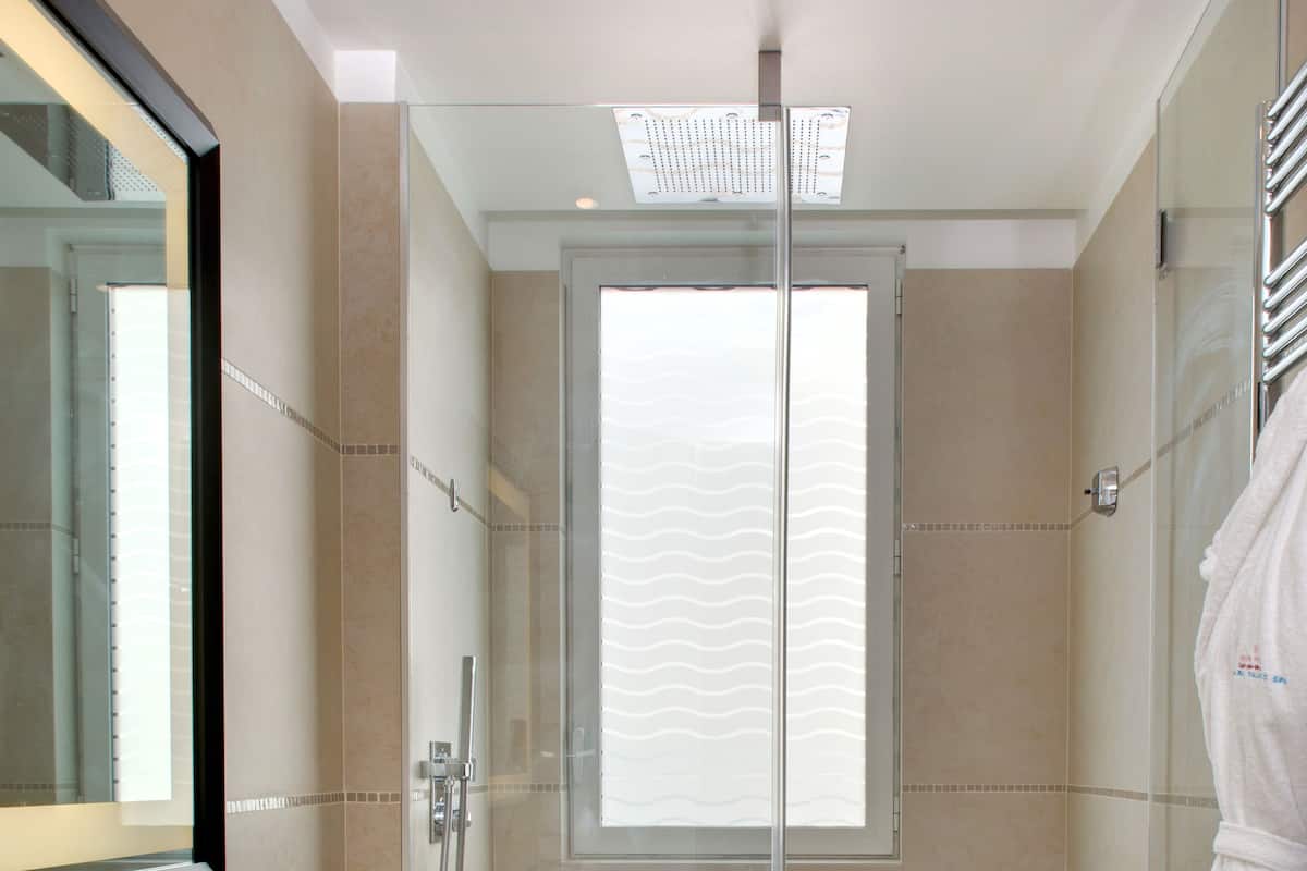 classic room with city view | bathroom | rainfall showerhead, free toiletries, hair dryer, bathrobes