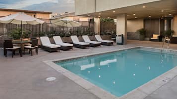 Outdoor pool, open 8:00 AM to 10:00 PM, pool umbrellas, sun loungers