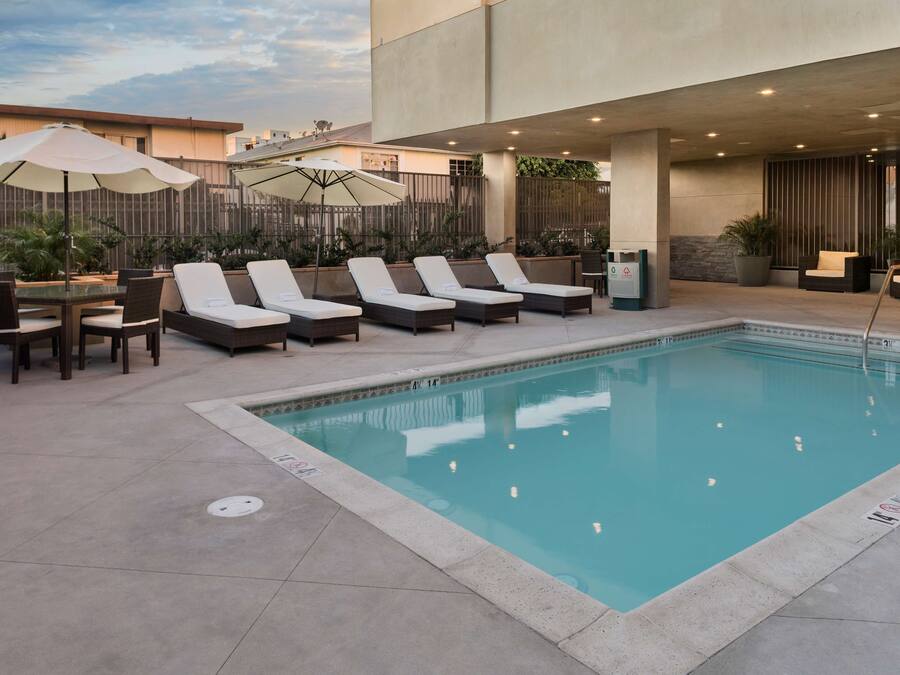 Outdoor pool, open 8:00 AM to 10:00 PM, pool umbrellas, sun loungers