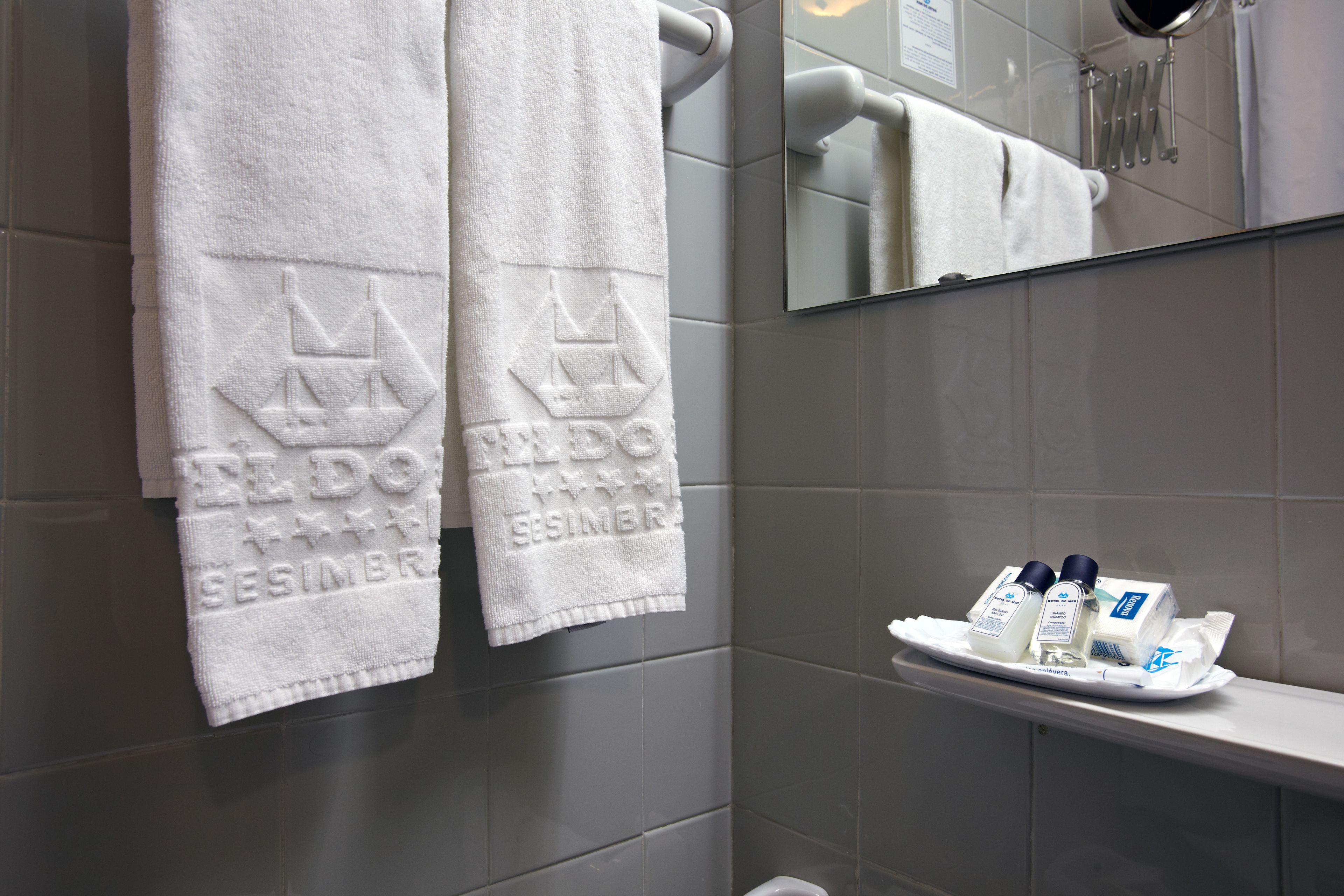 bathtub, hair dryer, bidet, towels