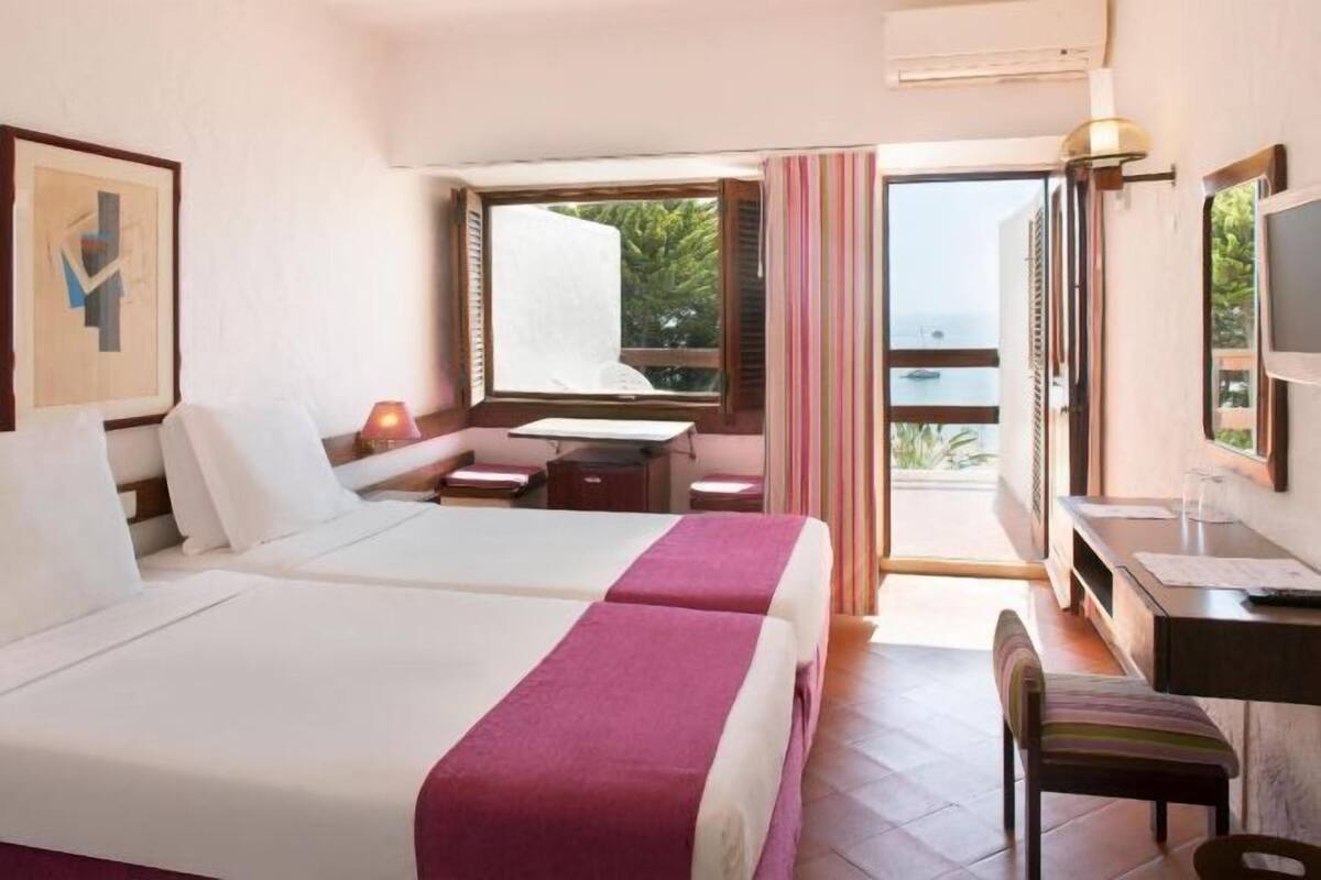 Desk, blackout drapes, rollaway beds (surcharge), WiFi (free)