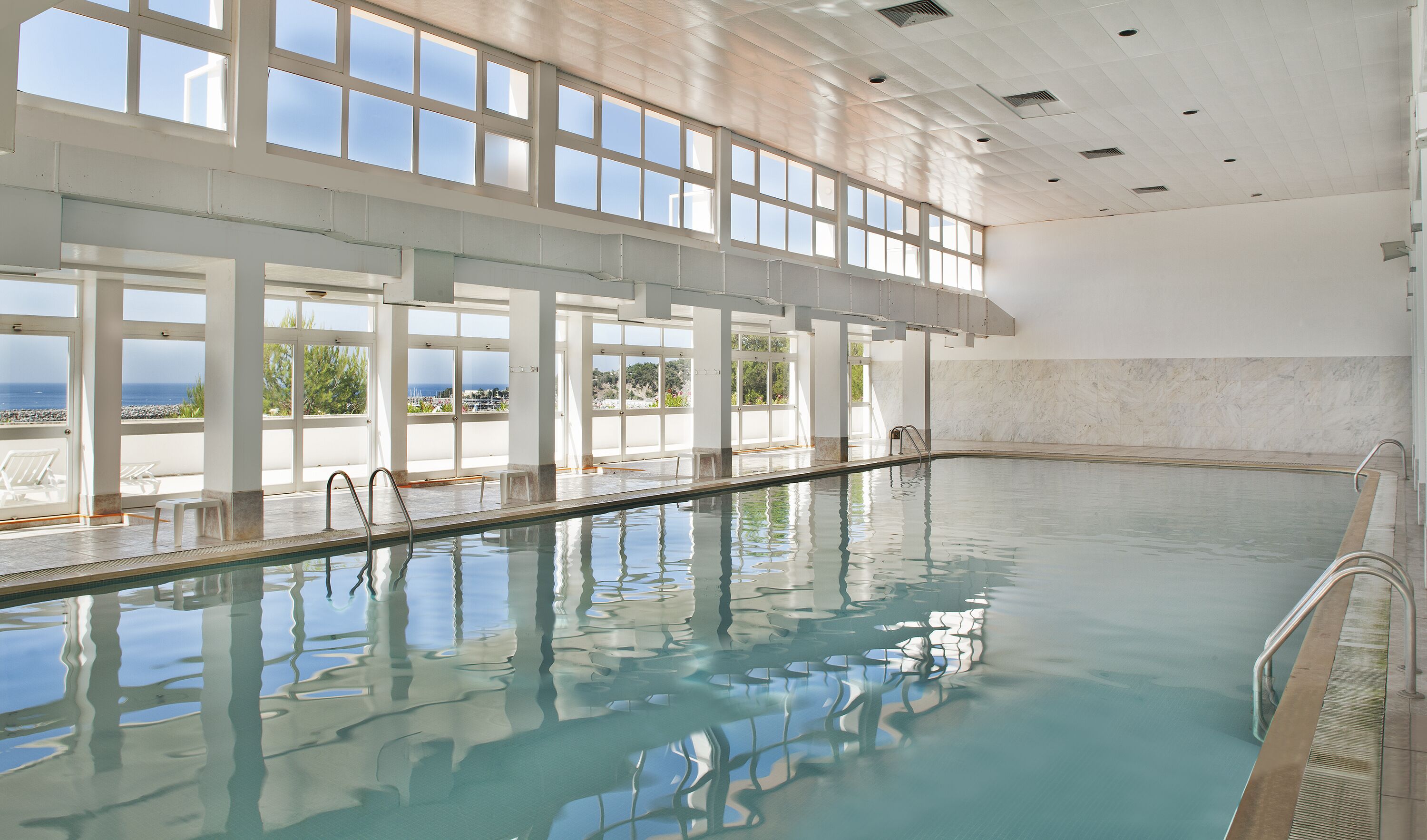 Outdoor pool, open 9:30 AM to 6:30 PM, pool umbrellas, pool loungers