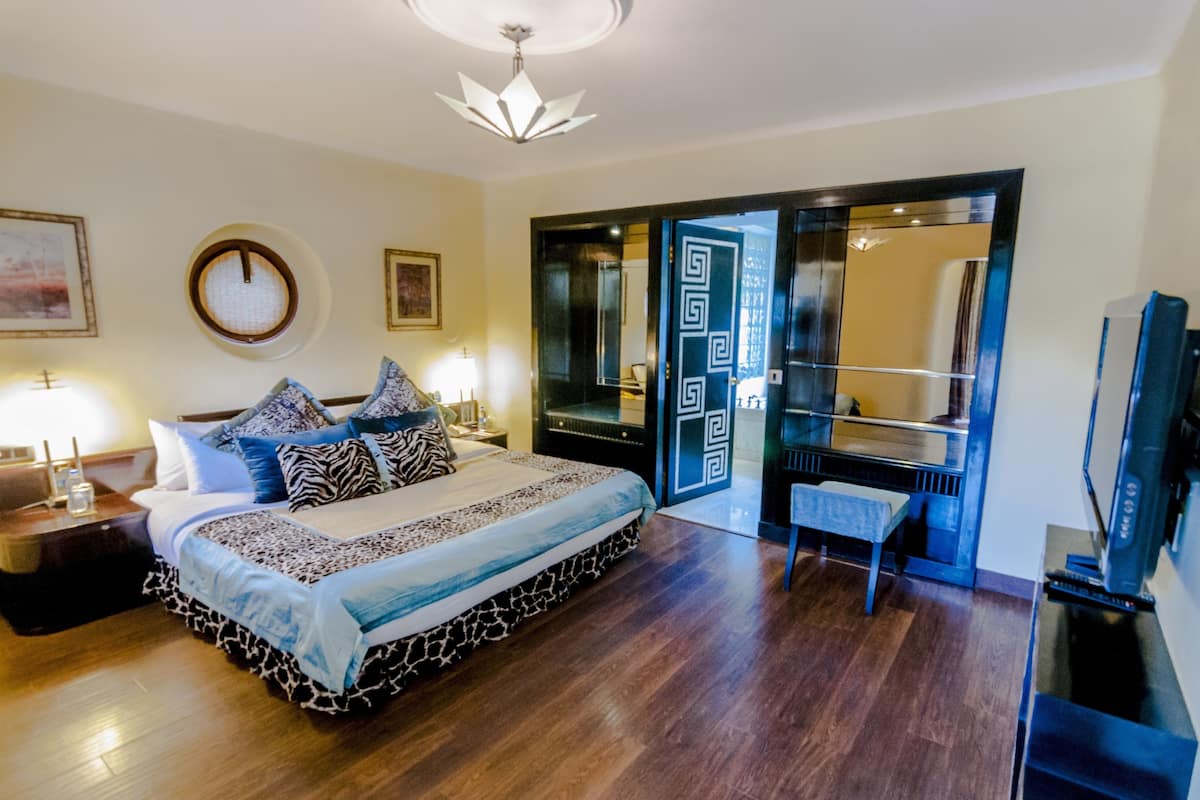 seleqtions suite garden view double bed | living area | lcd tv