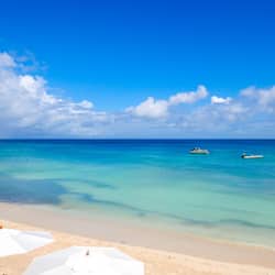 On the beach, sun-loungers, beach umbrellas, beach towels