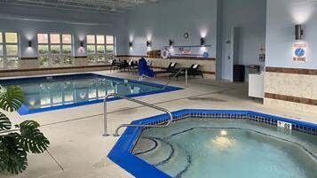 Indoor pool, open 8:00 AM to 11:00 PM, pool loungers