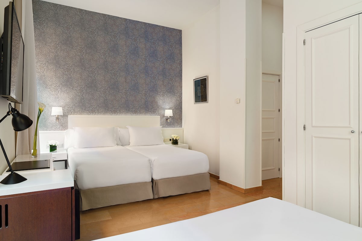 Junior Suite | Minibar, in-room safe, iron/ironing board, free WiFi