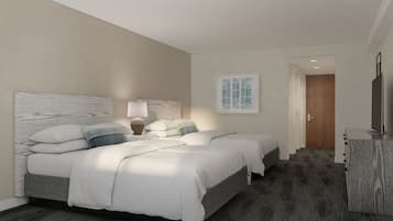 A hotel room with two beds, a desk, and a TV.