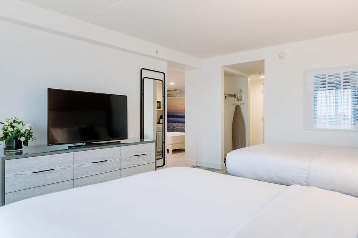 Family Twin Room (2 Queens, and 2 Twin Beds) | In-room safe, laptop workspace, soundproofing, iron/ironing board
